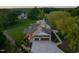 Aerial view of estate with manicured lawn, and 3-car garage at 1641 Legacy Ridge Ln, Wake Forest, NC 27587