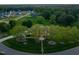 Overhead view of home surrounded by mature trees, lush landscaping, and expansive lawn at 1641 Legacy Ridge Ln, Wake Forest, NC 27587
