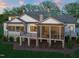 Back of home featuring stone and siding exterior, balcony, and screened-in porch at 1641 Legacy Ridge Ln, Wake Forest, NC 27587