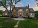 An estate home, showcasing stone and siding accents, with a stone walkway to the front door at 1641 Legacy Ridge Ln, Wake Forest, NC 27587