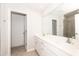 Modern bathroom with double vanity, quartz countertop, and a glass-enclosed shower, offering a clean and bright aesthetic at 567 Marthas Vw Way, Wake Forest, NC 27587