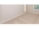 Minimalist bedroom with carpet flooring and a view from the window at 567 Marthas Vw Way, Wake Forest, NC 27587