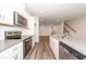 Kitchen view showcasing granite countertops and stainless steel appliances at 567 Marthas Vw Way, Wake Forest, NC 27587