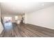 Open-concept living area featuring hardwood floors, abundant natural light, and seamless access to the modern kitchen at 567 Marthas Vw Way, Wake Forest, NC 27587