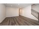 Spacious living room with modern flooring and staircase access at 567 Marthas Vw Way, Wake Forest, NC 27587