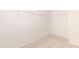 Walk-in closet with shelving and neutral carpet flooring at 567 Marthas Vw Way, Wake Forest, NC 27587