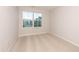 Cozy bedroom with a large window allowing natural light and plush carpeting at 569 Marthas Vw Way, Wake Forest, NC 27587