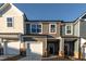 Charming townhome featuring a two-car garage and appealing exterior color scheme at 569 Marthas Vw Way, Wake Forest, NC 27587