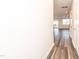 Hallway leading to the living area showcasing the modern flooring and paint at 569 Marthas Vw Way, Wake Forest, NC 27587