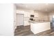Bright kitchen featuring white cabinets, granite countertops, and modern appliances at 569 Marthas Vw Way, Wake Forest, NC 27587