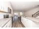 Modern kitchen features a large island, white cabinets, and granite countertops at 569 Marthas Vw Way, Wake Forest, NC 27587