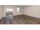Bright living room featuring modern flooring and a sliding door leading to outdoor space at 569 Marthas Vw Way, Wake Forest, NC 27587