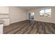 Bright living room features wood flooring and a sliding door to outside at 569 Marthas Vw Way, Wake Forest, NC 27587