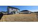 Expansive backyard with newly laid grass and partial fencing, perfect for outdoor enjoyment at 115 Shooting Star Trl, Youngsville, NC 27596