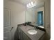 Stylish bathroom featuring a modern vanity, large mirror, and updated fixtures for a clean, elegant look at 115 Shooting Star Trl, Youngsville, NC 27596