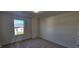 Clean, carpeted bedroom offers natural light through the window at 115 Shooting Star Trl, Youngsville, NC 27596