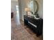 Inviting entryway features stylish console table, round mirror and wood flooring, setting a welcoming tone at 115 Shooting Star Trl, Youngsville, NC 27596