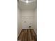 Simple laundry room with washer dryer hookups and upper shelving at 115 Shooting Star Trl, Youngsville, NC 27596