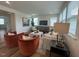 Comfortable living room with plush seating, contemporary décor, and large windows offering plenty of light at 115 Shooting Star Trl, Youngsville, NC 27596