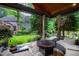 Landscaped backyard oasis with a fire pit, outdoor seating, and a sparkling pool offers resort-style living at 1800 Bay Meadow Ct, Raleigh, NC 27615