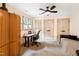 Bedroom with comfortable furniture, including a bed, desk, and floor to ceiling wood cabinet at 1800 Bay Meadow Ct, Raleigh, NC 27615