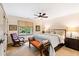 Charming bedroom features natural light, a ceiling fan, and a cozy seating area with a rocking chair at 1800 Bay Meadow Ct, Raleigh, NC 27615