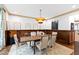 Formal dining room featuring wood trim, stylish chandelier and seating for six guests at 1800 Bay Meadow Ct, Raleigh, NC 27615