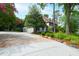 Beautiful home with a spacious driveway, lush landscaping, and attached garage, exuding curb appeal at 1800 Bay Meadow Ct, Raleigh, NC 27615