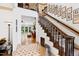Grand foyer featuring a staircase, a high ceiling, and an open view to the formal living room at 1800 Bay Meadow Ct, Raleigh, NC 27615