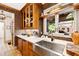 Close up of kitchen featuring designer backsplash, sink with a view, and glass front cabinets at 1800 Bay Meadow Ct, Raleigh, NC 27615