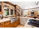 Spacious kitchen area with mosaic backsplash, stainless steel sink, and natural light from the window at 1800 Bay Meadow Ct, Raleigh, NC 27615