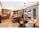 Open kitchen features island seating, a chef's kitchen and eat-in dining area with lots of natural light at 1800 Bay Meadow Ct, Raleigh, NC 27615
