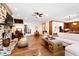 Open concept living room with brick fireplace, hardwood floors, and abundant natural light at 1800 Bay Meadow Ct, Raleigh, NC 27615