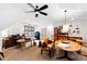 Bright living area featuring hardwood floors, large windows, a ceiling fan and stylish furniture arrangement at 1800 Bay Meadow Ct, Raleigh, NC 27615