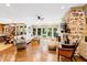 Bright living room featuring a fireplace, skylight, large windows, and comfortable seating at 1800 Bay Meadow Ct, Raleigh, NC 27615