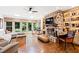 Bright living room with stone fireplace, large windows, and built-in shelving at 1800 Bay Meadow Ct, Raleigh, NC 27615