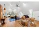 Spacious main bedroom with vaulted ceilings, arched windows, and a sitting area creates a relaxing retreat at 1800 Bay Meadow Ct, Raleigh, NC 27615
