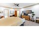 Spacious main bedroom with a sitting area and an ornate dresser with a television at 1800 Bay Meadow Ct, Raleigh, NC 27615