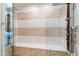 This walk-in shower offers multiple shower heads, a built-in bench, and a glass enclosure at 1800 Bay Meadow Ct, Raleigh, NC 27615