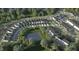 Aerial view of community with pond and multiple homes at 912 Allen Park Dr, Raleigh, NC 27604