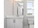 Bathroom showcasing a vanity with modern faucet and mirror, complimented by neutral walls and flooring at 912 Allen Park Dr, Raleigh, NC 27604