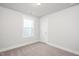 Bedroom showcasing plush neutral carpet, a window, and a classic white door at 912 Allen Park Dr, Raleigh, NC 27604