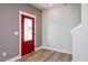 Bright entryway with red door and hardwood floors at 912 Allen Park Dr, Raleigh, NC 27604