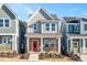 Two-story house with red door, gray siding, and brick accents at 912 Allen Park Dr, Raleigh, NC 27604