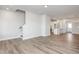 Open living room and kitchen with hardwood floors at 912 Allen Park Dr, Raleigh, NC 27604