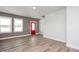 Living room with hardwood floors and red door at 912 Allen Park Dr, Raleigh, NC 27604