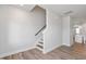 Modern staircase with hardwood floors and white walls at 912 Allen Park Dr, Raleigh, NC 27604