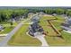 Expansive property featuring a modern home with a pristine lawn and a charming wooden fence at 25 Cotton Fields Ln # 29, Fuquay Varina, NC 27526