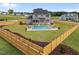 An expansive backyard with a sparkling pool, deck chairs and an appealing wood fence at 25 Cotton Fields Ln # 29, Fuquay Varina, NC 27526