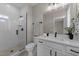 Stylist bathroom featuring a tiled shower, white vanity, and matte black fixtures for a spa like experience at 25 Cotton Fields Ln # 29, Fuquay Varina, NC 27526